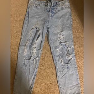 Light blue ripped jeans. Size 7.